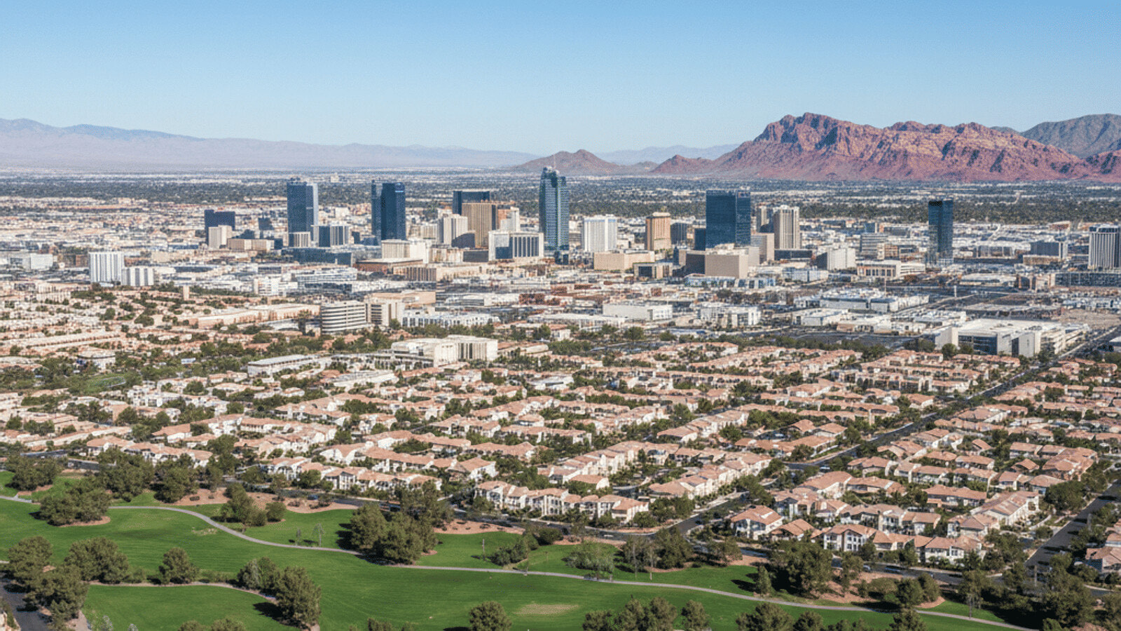 North Las Vegas residential street with newer apartment community and Mountain backdrop 2026